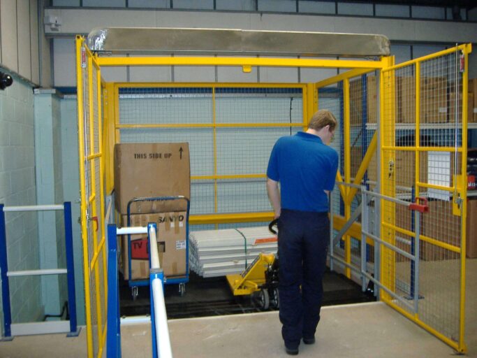 photo of a man safely moving goods between floors using an elevator