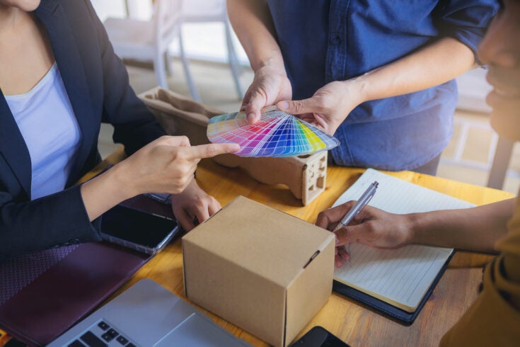a team of people discussing packaging options