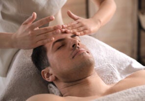 a man receiving a facial massage