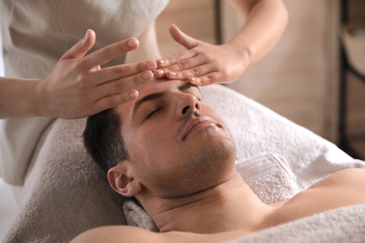 a man receiving a facial massage