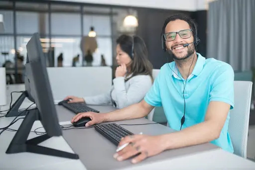 a man and woman working in a call center
