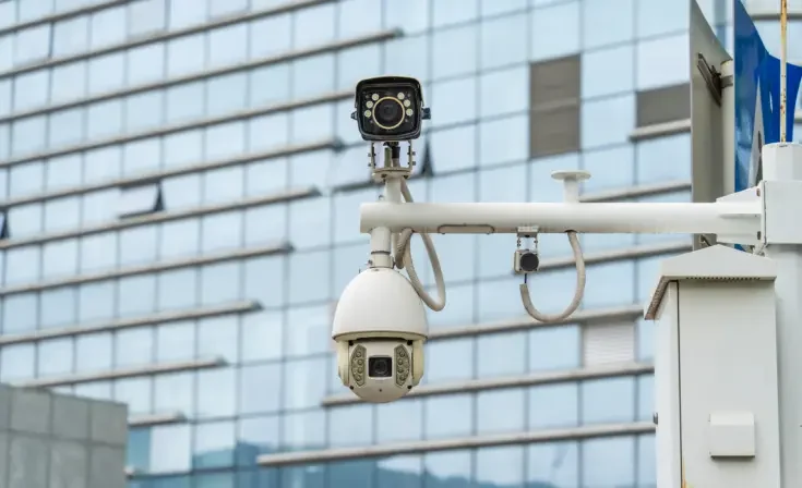 CCTV surveillance camera on building window