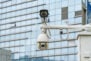 CCTV surveillance camera on building window