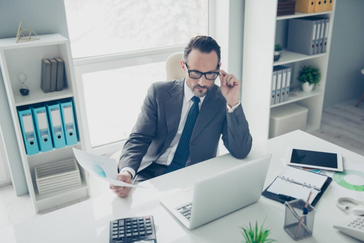High angle top view attractive agent ceo economist employee man in trendy style chic classy formalwear look on pc gadget screen monitor hold conference blank sit on chair armchair behind table