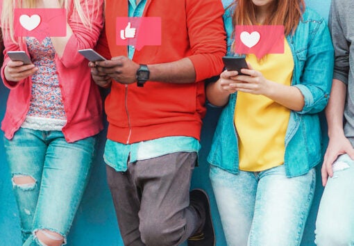Group of friends watching smart mobile phones - Teenagers addiction to new technology trends - Concept of youth, tech, social and friendship - Main focus on center hands
