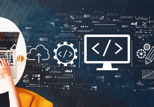 Web development concept with person using a laptop on a white table