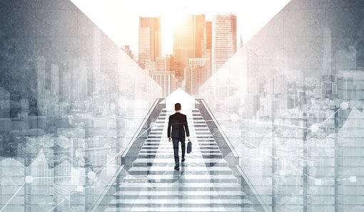 man walking up outside stairs