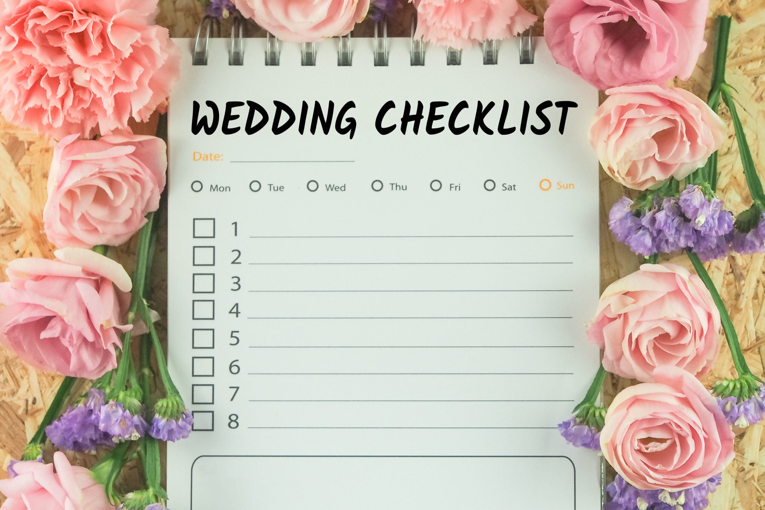 word wedding checklist note paper on pink flower background