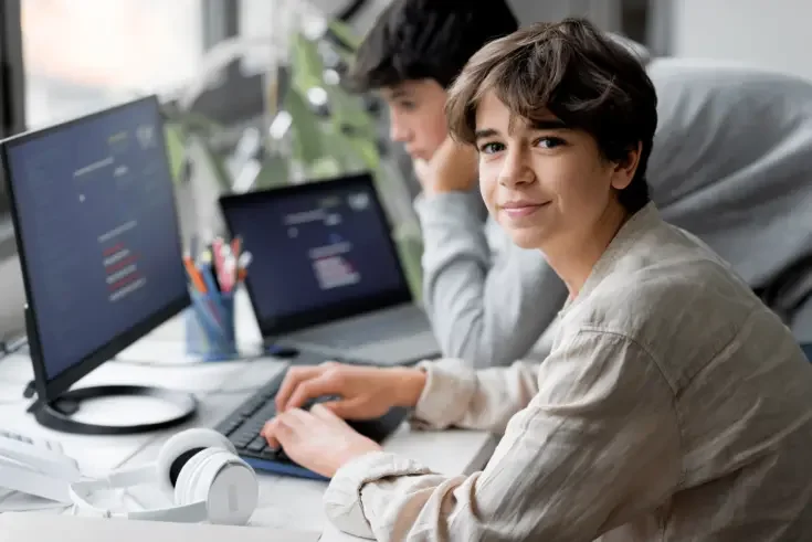 Young teens using computers