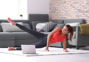 young woman doing fitness exercise at home