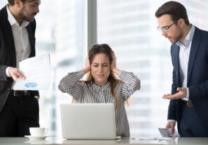 Stressed frustrated female CEO or boss closing ears abstracting from annoying colleagues or subordinates, woman feeling despair avoiding bothering clients, ignoring solving problems, do not want work