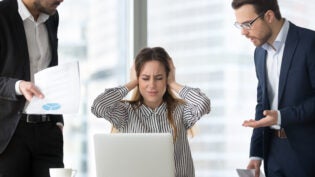 Stressed frustrated female CEO or boss closing ears abstracting from annoying colleagues or subordinates, woman feeling despair avoiding bothering clients, ignoring solving problems, do not want work