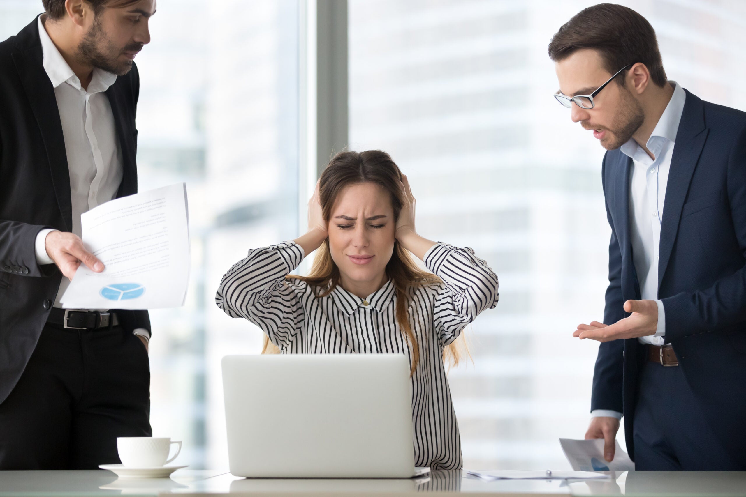 Stressed frustrated female CEO or boss closing ears abstracting from annoying colleagues or subordinates, woman feeling despair avoiding bothering clients, ignoring solving problems, do not want work