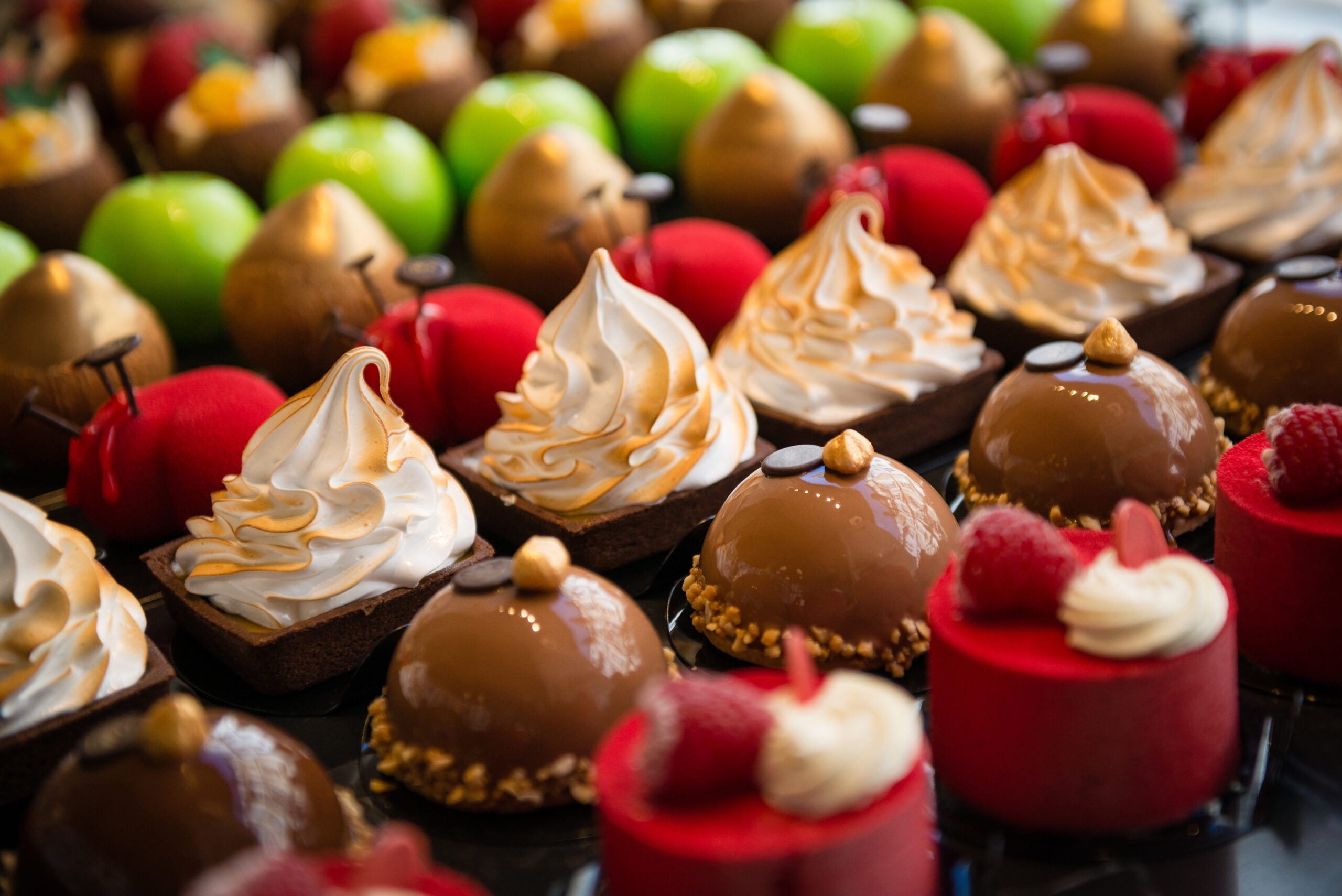 Delicious cakes on display with dark background