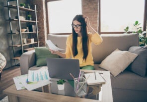 Doubtful uncertain female marketer holding document trying to find startup solution