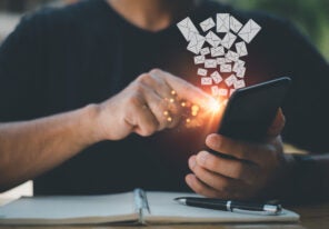 A person using a smartphone with an email icon being sent out.