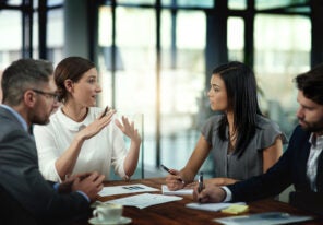 Business people, conversation and paperwork in meeting for strategy on international growth, network expansion and benchmarking. Corporate, teamwork and talk for collaboration, planning and research.