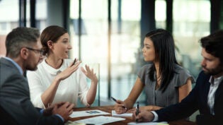 Business people, conversation and paperwork in meeting for strategy on international growth, network expansion and benchmarking. Corporate, teamwork and talk for collaboration, planning and research.