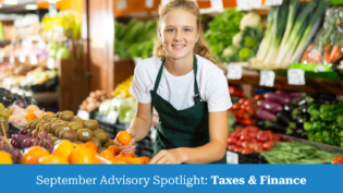 Woman arranging fruit in grocery store