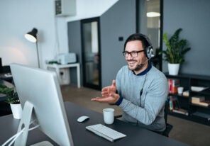 Young man having online call at modern office.