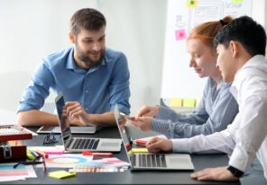 Young IT designers working in office