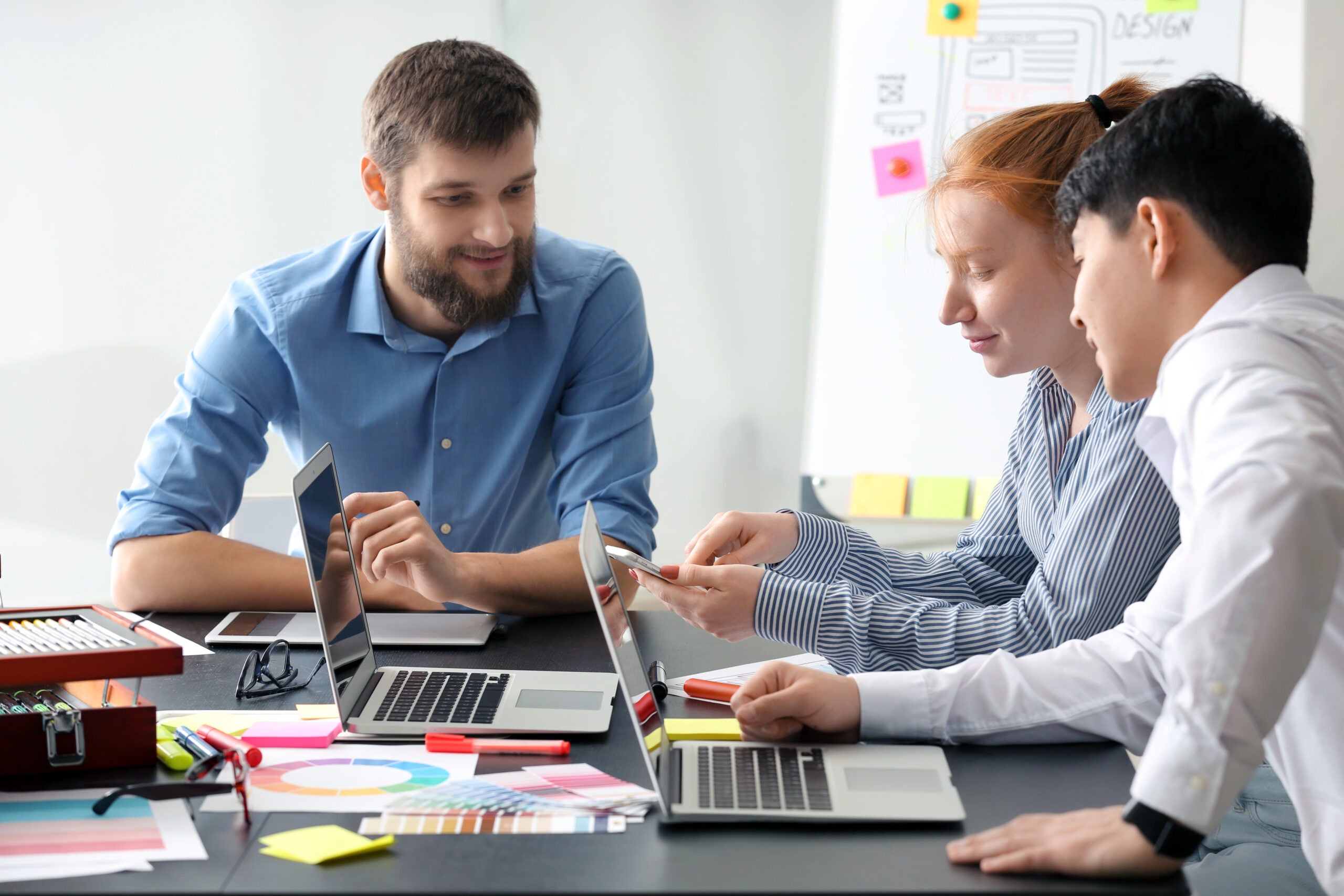 Young IT designers working in office