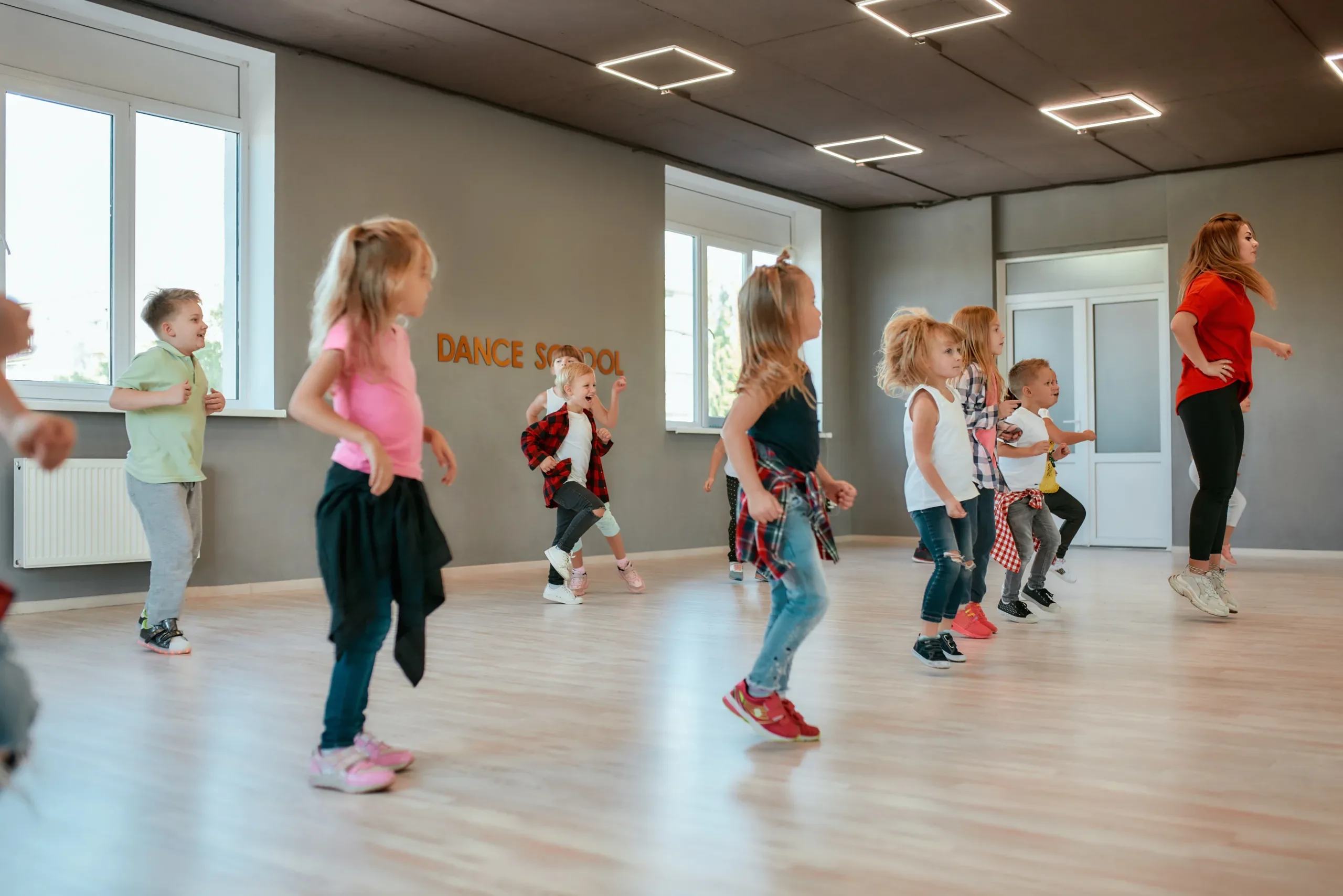 Group of active children dancing