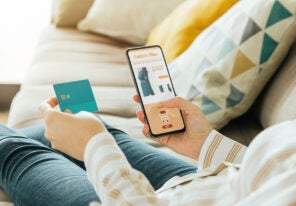 woman buying a dress online with the phone