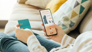 woman buying a dress online with the phone