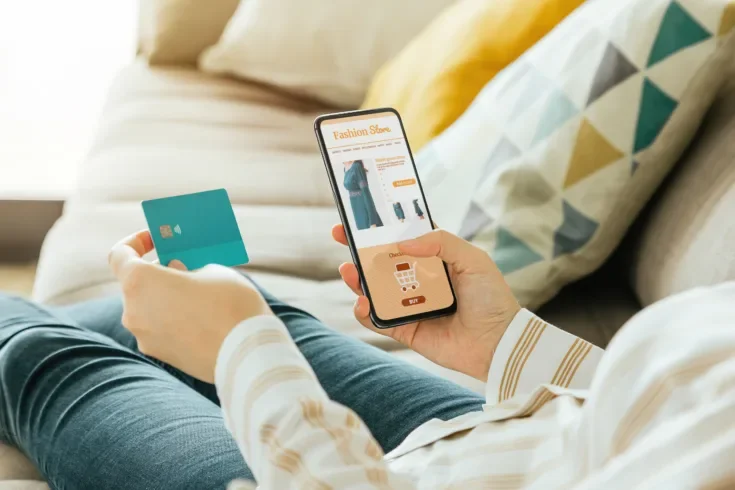 woman buying a dress online with the phone