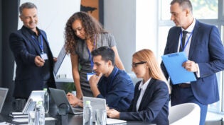 Team of business people during meeting in office