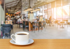 cup of coffee on coffee shop background.