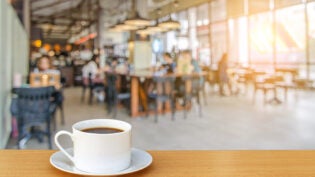 cup of coffee on coffee shop background.