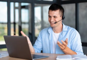 employee call center, businessman, customer support manager wearing with headset using laptop computer for virtual meeting consulting client at on video call