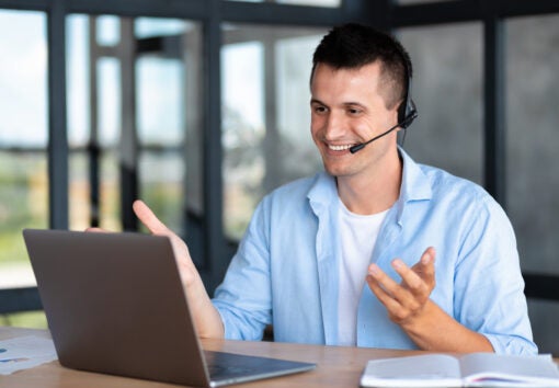 employee call center, businessman, customer support manager wearing with headset using laptop computer for virtual meeting consulting client at on video call