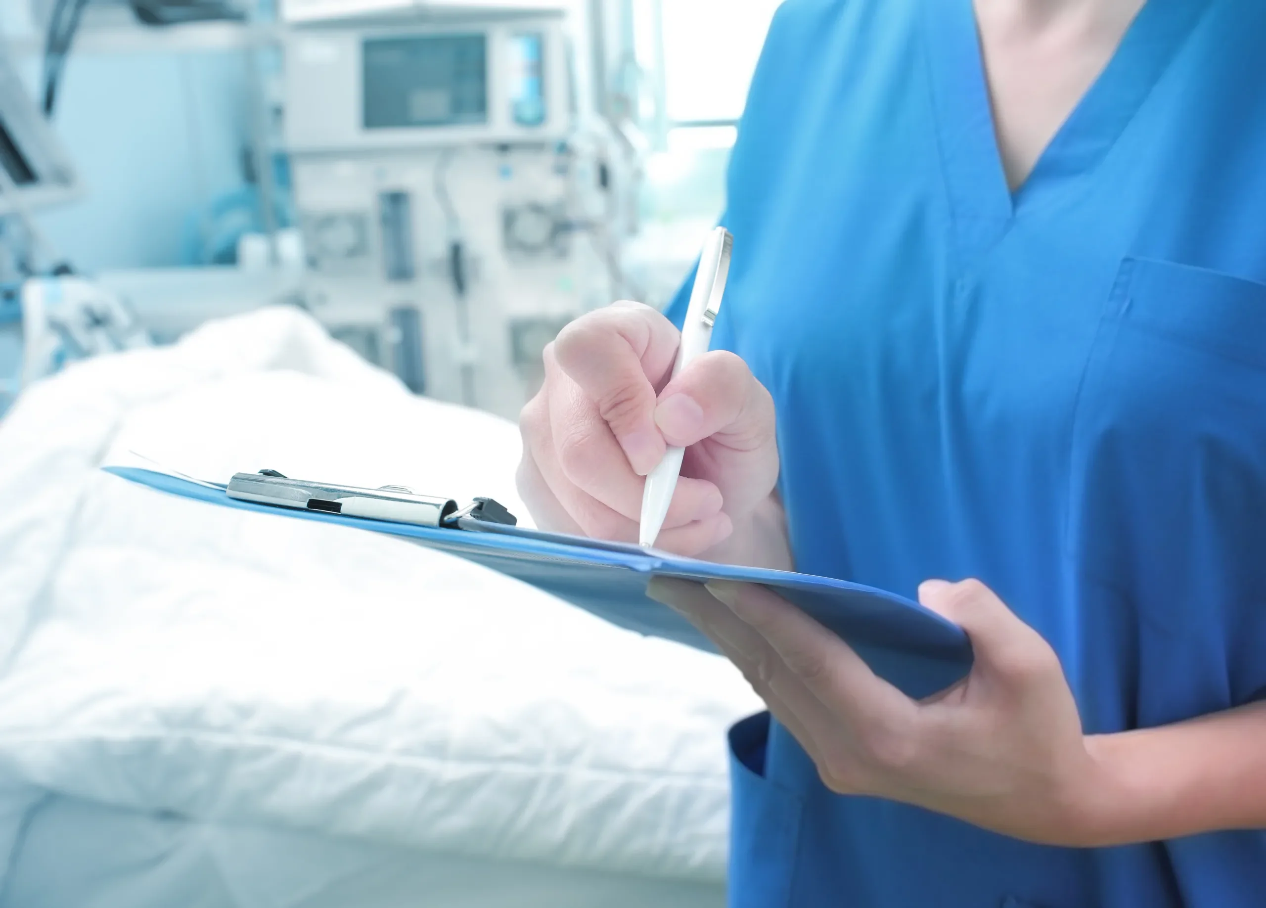 Female nurse monitors the patient's condition