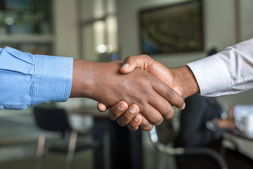 Men's hands clasped in a handshake