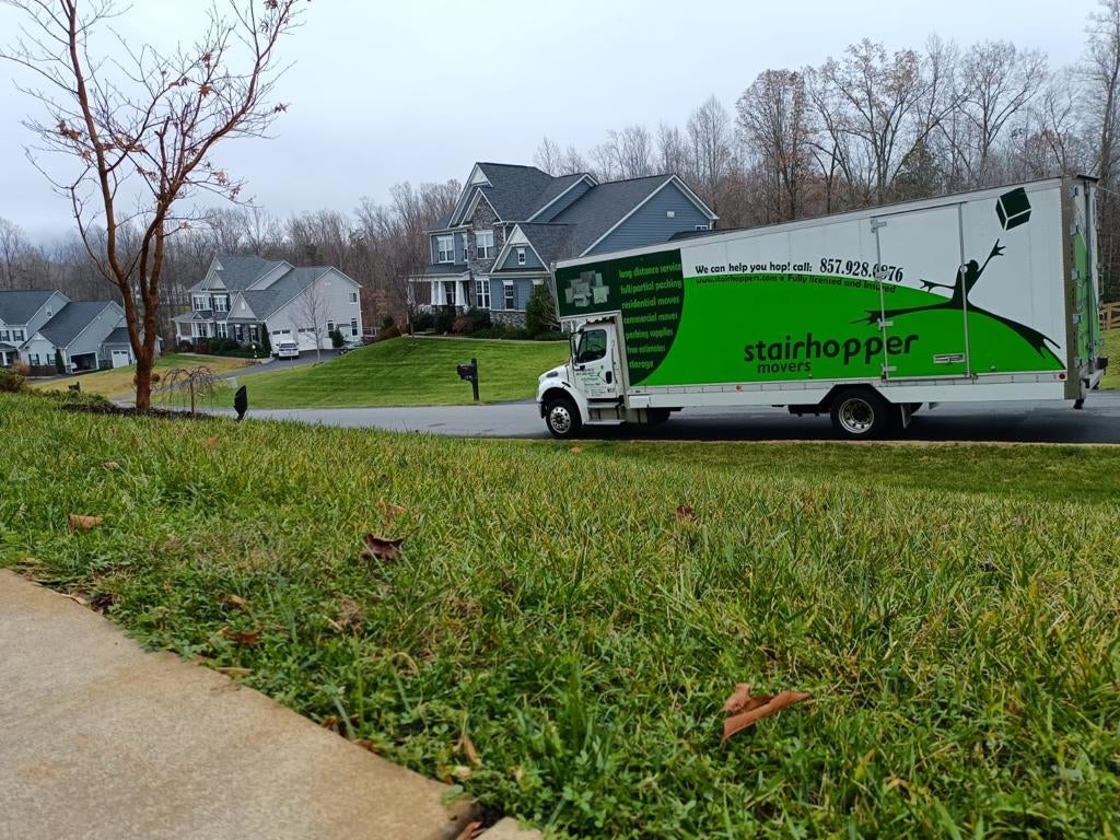 moving van in front of homes