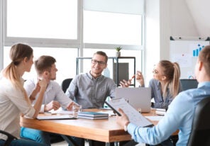 Group of young people at business meeting in office