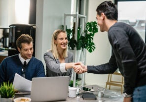 two financial advisors having a meeting with a male client