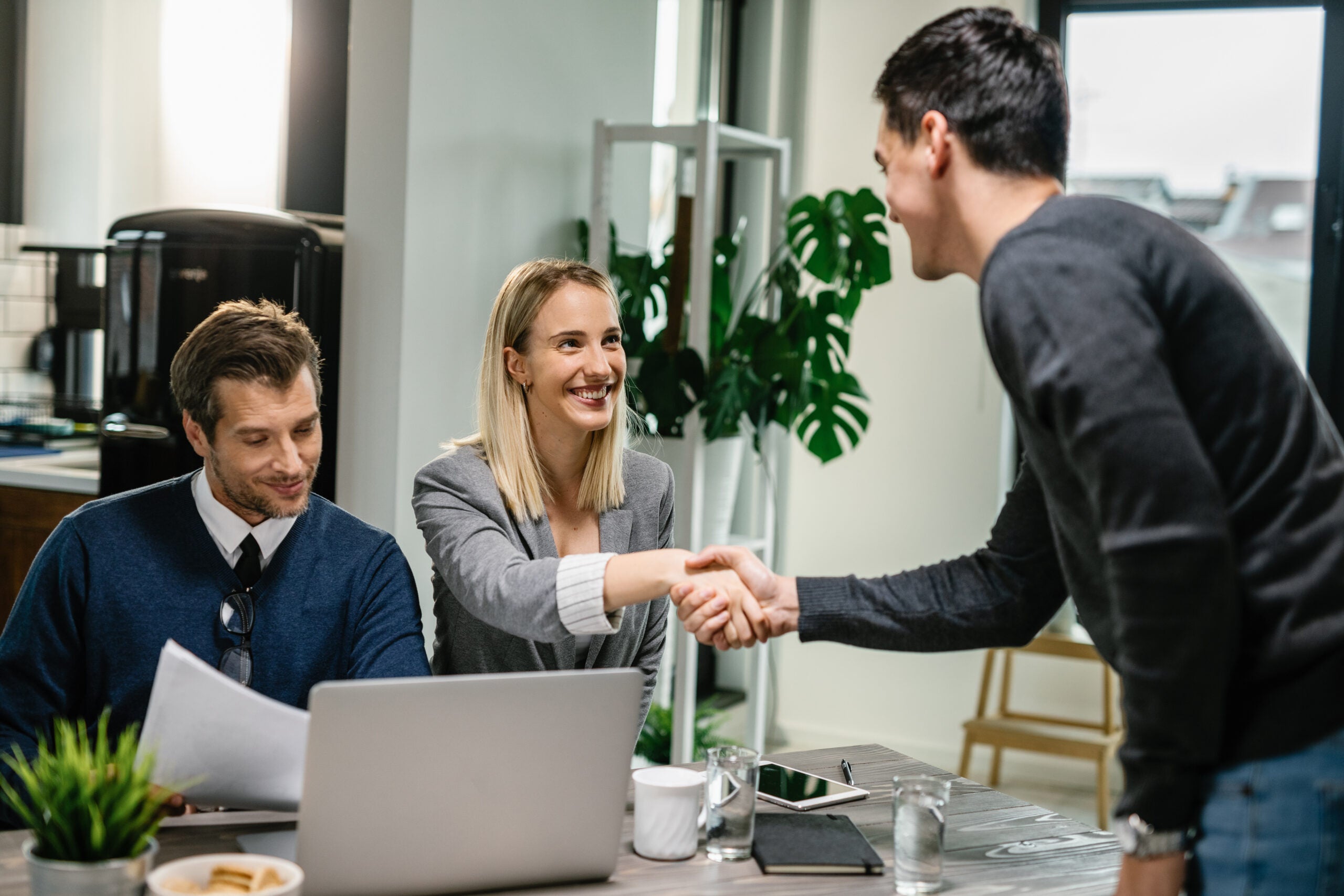 two financial advisors having a meeting with a male client