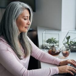 woman working on notebook at home