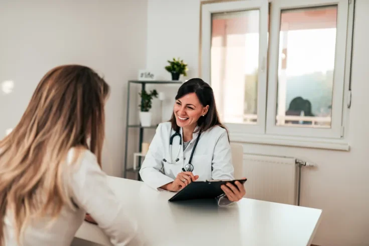 female specialist talking to her patient.