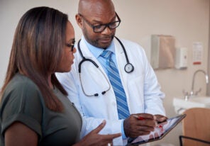 Doctor talking to woman