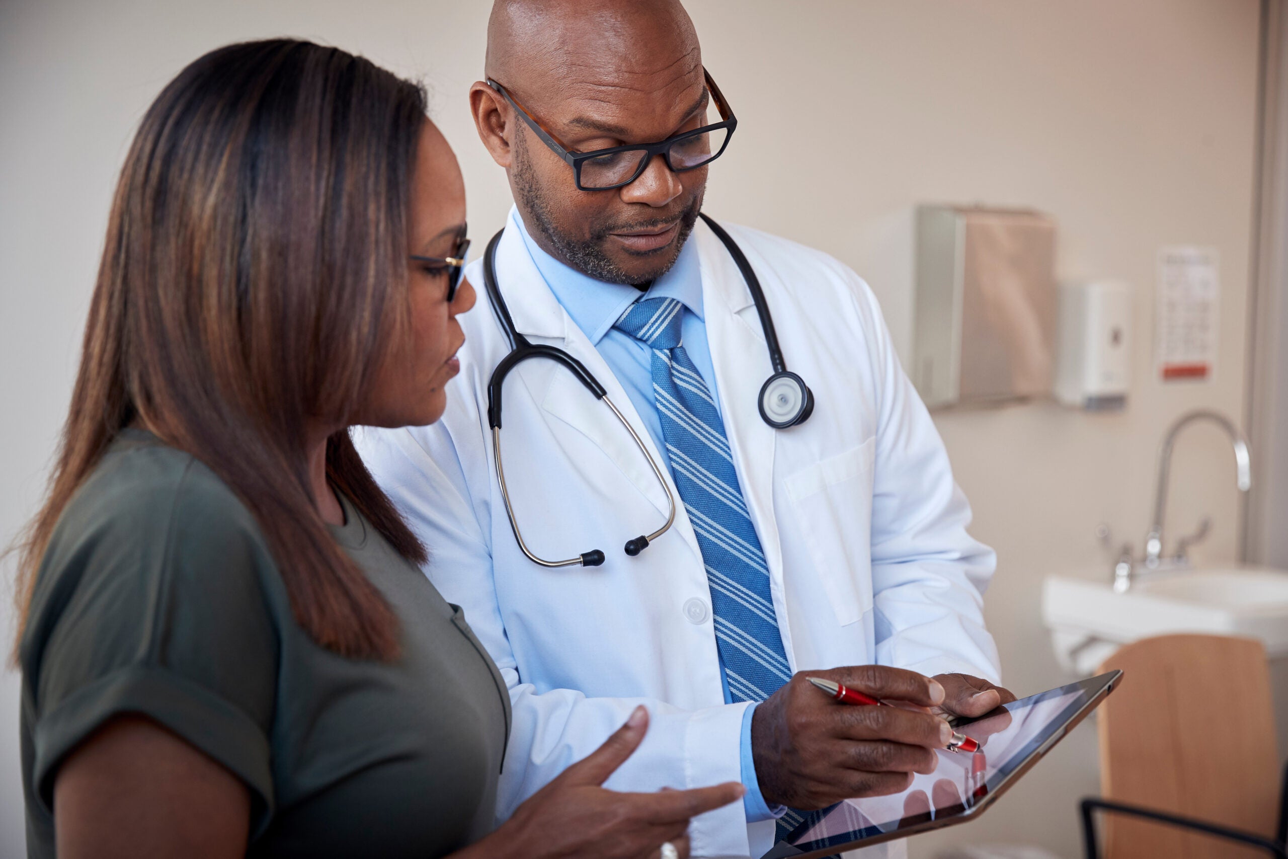 Doctor talking to woman