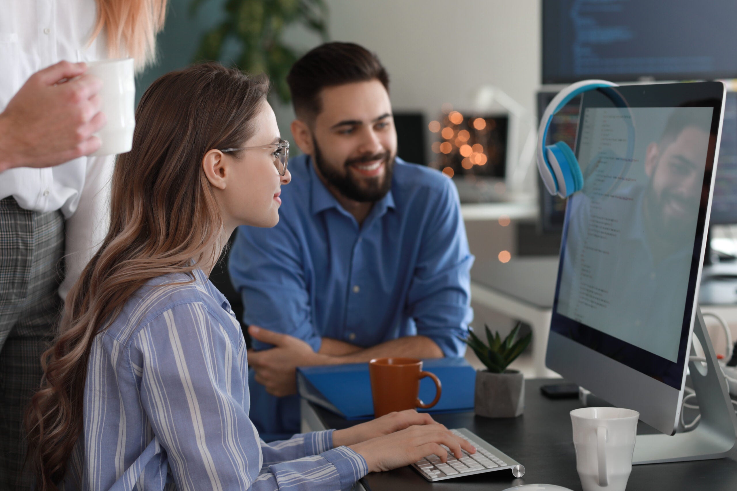 Team of programmers working in office