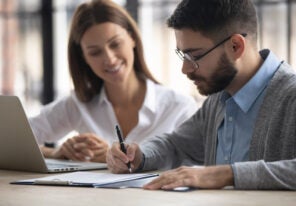 businessman signing partnership agreement