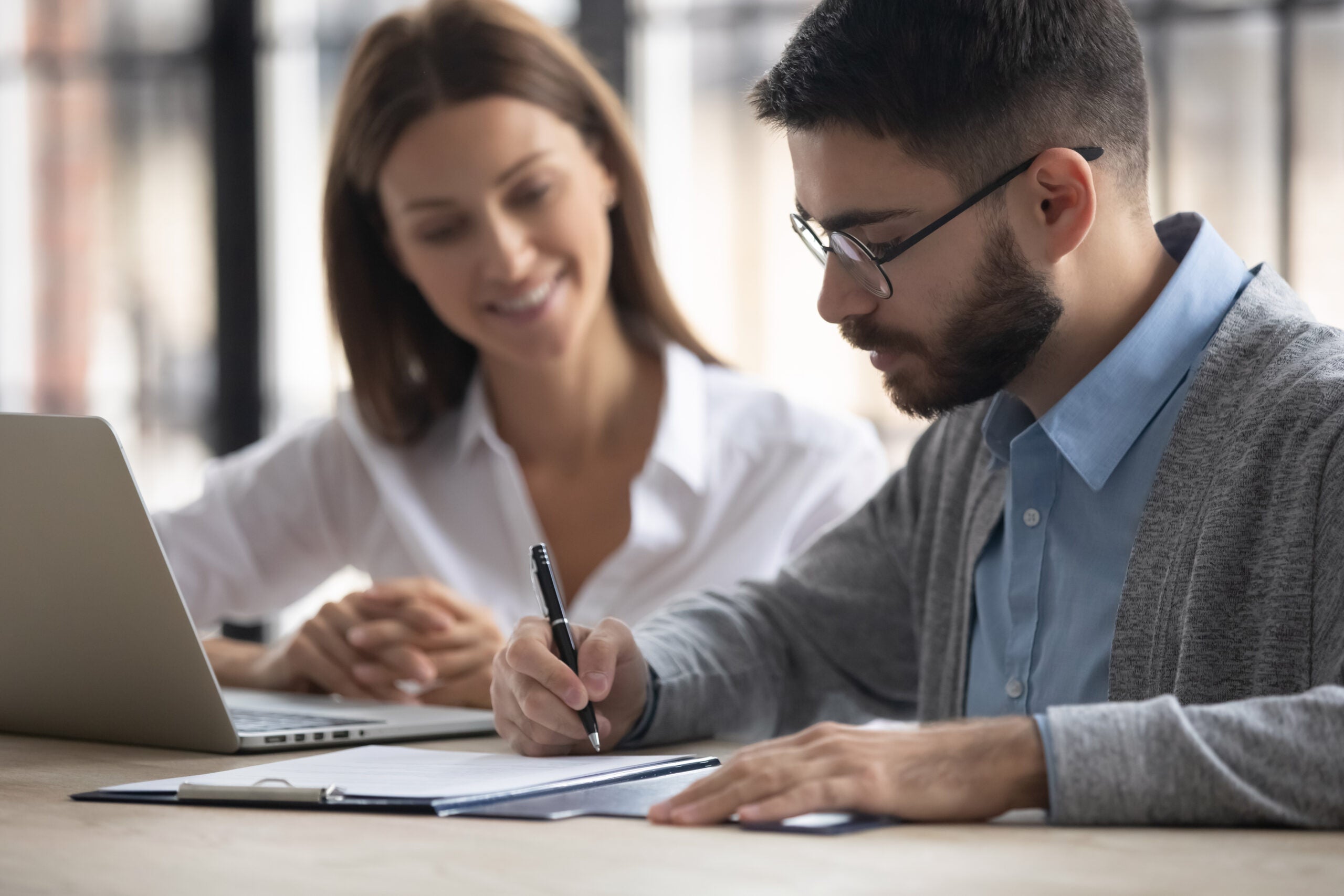 businessman signing partnership agreement