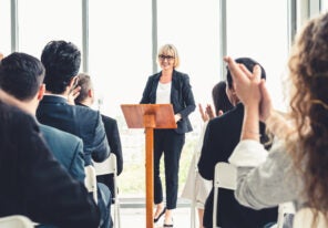 woman leading a conference