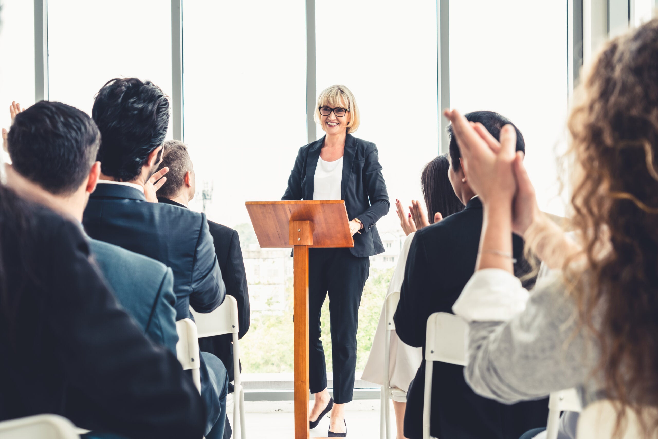 woman leading a conference